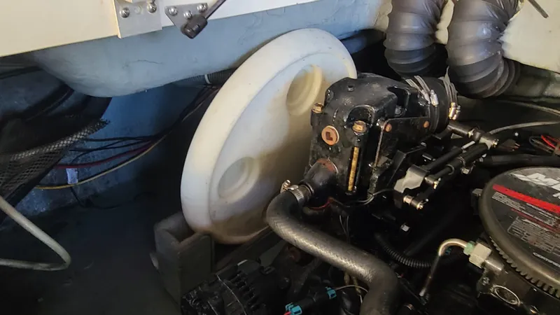 Slide: The Image of Engine compartment of a 2006 Bayliner 197 SD boat showing mechanical components. - 31