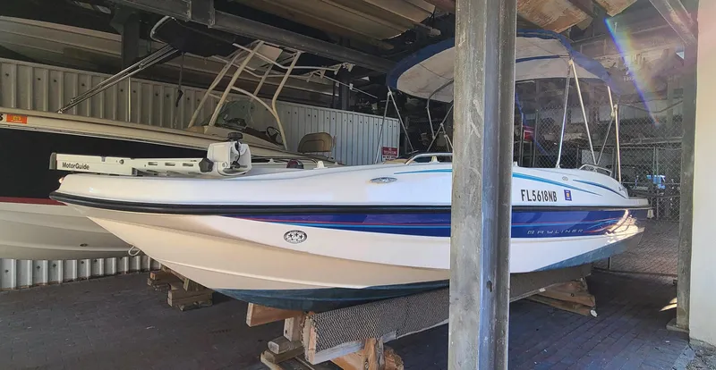 Slide: The Image of 2006 Bayliner 197 SD boat stored in a covered dock. - 5