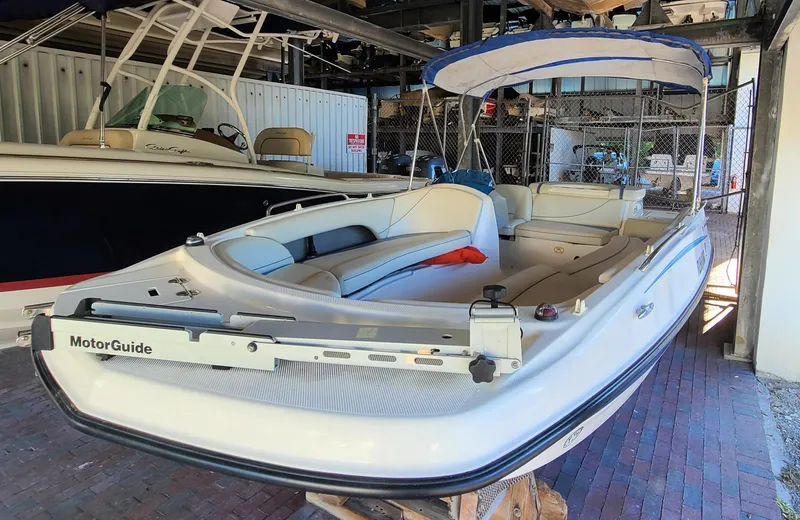 Slide: The Image of 2006 Bayliner 197 SD boat with MotorGuide trolling motor in storage. - 6