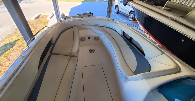 Slide: The Image of 2006 Bayliner 197 SD boat interior with white and gray seating. - 7
