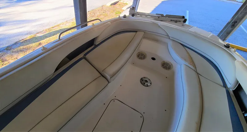 Slide: The Image of 2006 Bayliner 197 SD boat interior with spacious seating and built-in speakers. - 9