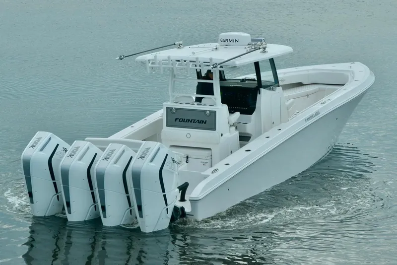 Slide: The Image of 2024 Fountain Bluewater 38 Tournament Edition boat with four outboard engines. - 2