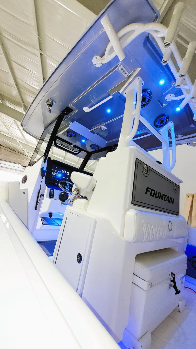 Slide: The Image of 2024 Fountain Bluewater 38 Tournament Edition boat interior with blue LED lighting. - 28
