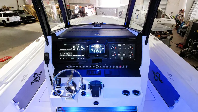 Slide: The Image of 2024 Fountain Bluewater 38 Tournament Edition boat dashboard with advanced navigation controls. - 29