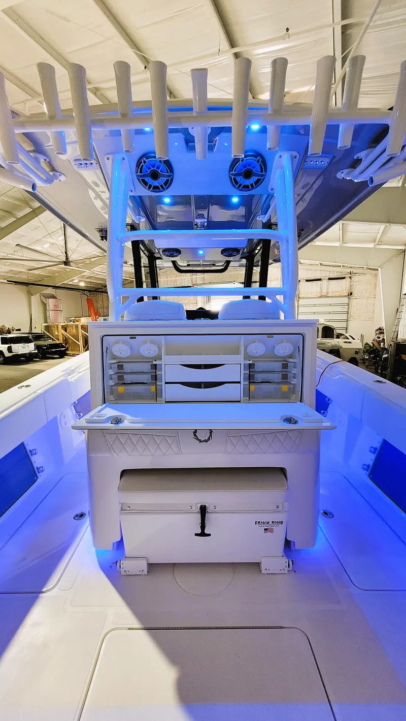 Slide: The Image of 2024 Fountain Bluewater 38 Tournament Edition boat interior with blue LED lighting. - 32