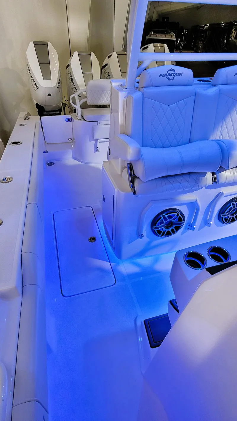 Slide: The Image of 2024 Fountain Bluewater 38 Tournament Edition boat interior with blue LED lighting. - 36