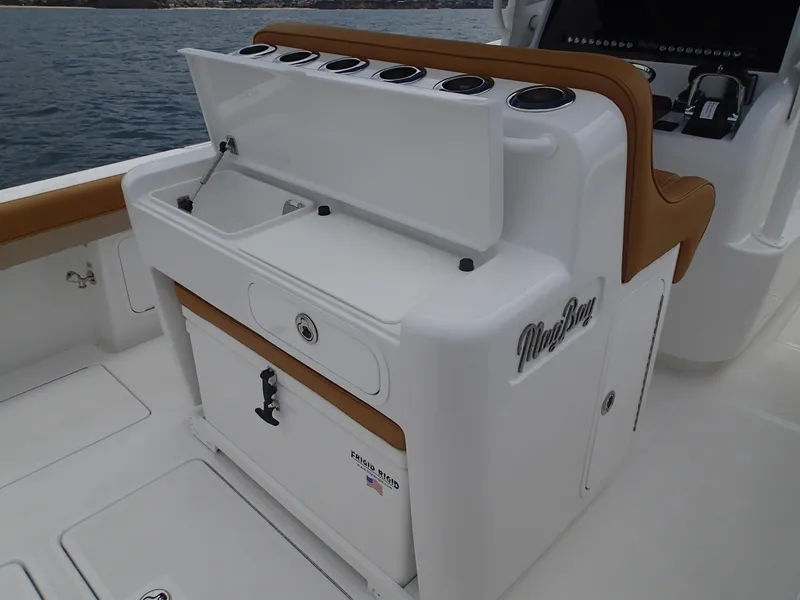 Slide: The Image of Mag Bay 33 CC 2025 center console boat with open storage compartment. - 21