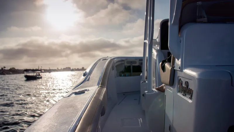 Slide: The Image of 2025 Mag Bay 33 CC boat on water at sunset. - 22