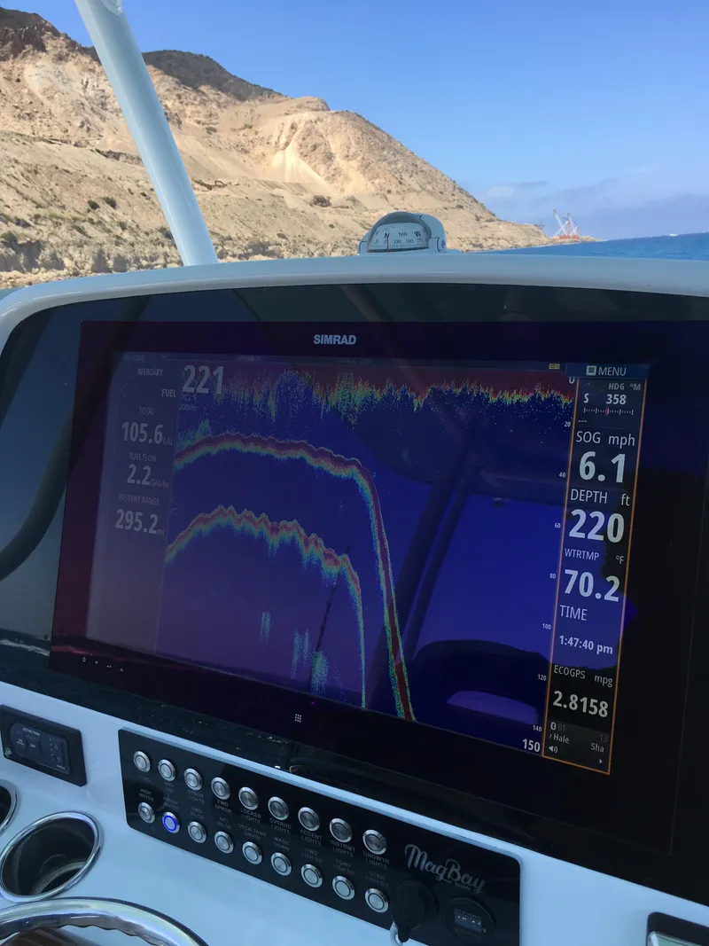 Slide: The Image of 2025 Mag Bay 33 CC boat with Simrad navigation system - 24