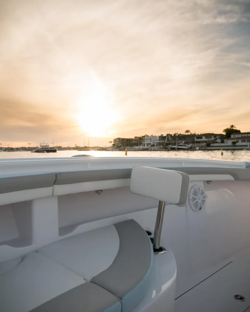 Slide: The Image of 2025 Mag Bay 33 CC boat at sunset on the water. - 38