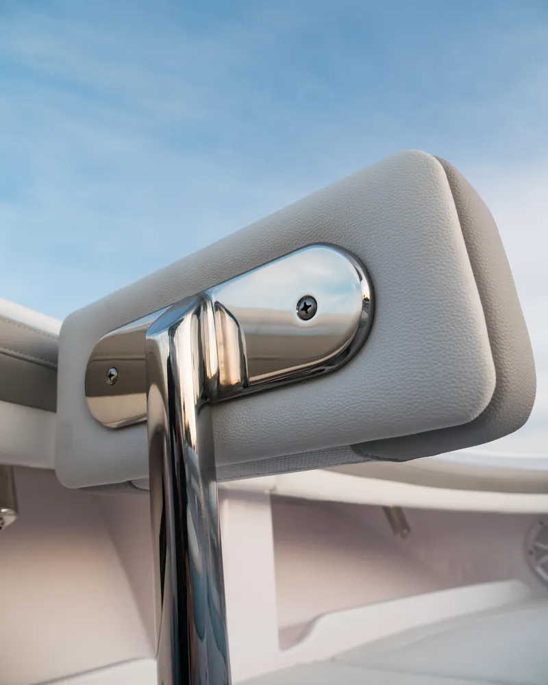 Slide: The Image of Close-up of 2025 Mag Bay 33 CC boat's stainless steel and cushioned handrail. - 39