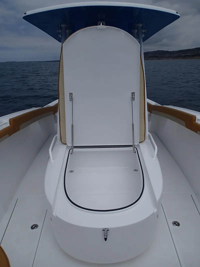 Slide: The Image of 2025 Mag Bay 33 CC center console boat with open storage compartment. - 40
