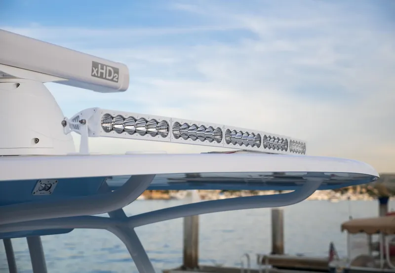 Slide: The Image of 2025 Mag Bay 33 CC boat with advanced radar and light bar at the marina. - 9