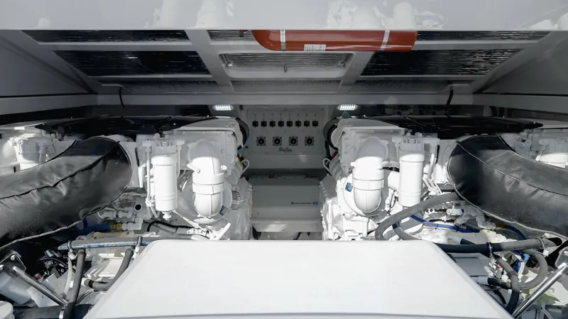 Slide: The Image of Engine room of 2025 Mag Bay 42 boat with dual engines and control panel. - 15