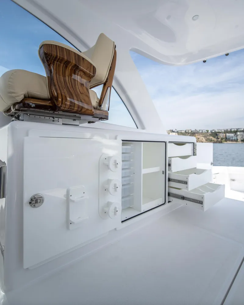 Slide: The Image of 2025 Mag Bay 42 yacht interior with luxurious seating and storage compartments. - 22