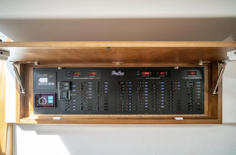 Slide: The Image of Electrical control panel of a 2025 Mag Bay 42 boat. - 27