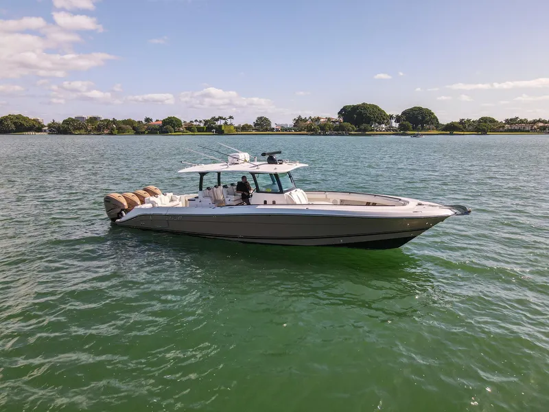 Slide: The Image of A 2020 HCB 42 Siesta on calm waters, featuring a sleek design and spacious deck. - 1