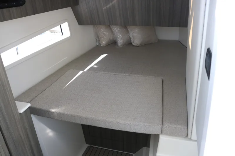 Slide: The Image of 2023 World Cat 400DC-X cabin interior with bed and window. - 11
