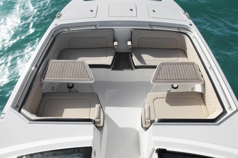 Slide: The Image of 2023 World Cat 400DC-X boat with spacious seating and tables on the deck. - 17