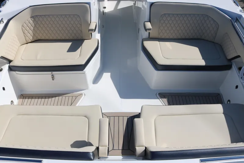Slide: The Image of 2023 World Cat 400DC-X boat interior with beige cushioned seating. - 19