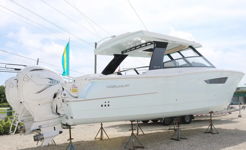 Slide: The Image of 2023 World Cat 400DC-X boat on stands, side view. - 2