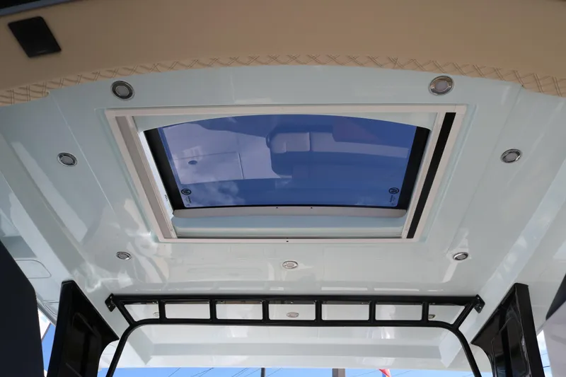 Slide: The Image of 2023 World Cat 400DC-X boat interior with sunroof and LED lighting. - 23