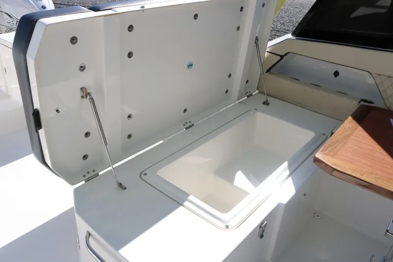 Slide: The Image of Open storage compartment on a 2023 World Cat 400DC-X boat. - 25