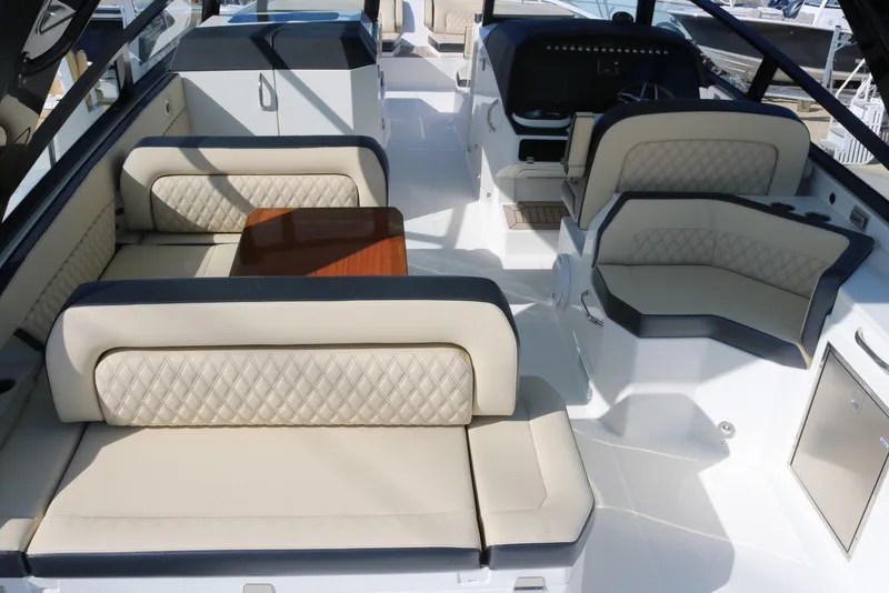Slide: The Image of 2023 World Cat 400DC-X boat interior with luxurious seating and table. - 34
