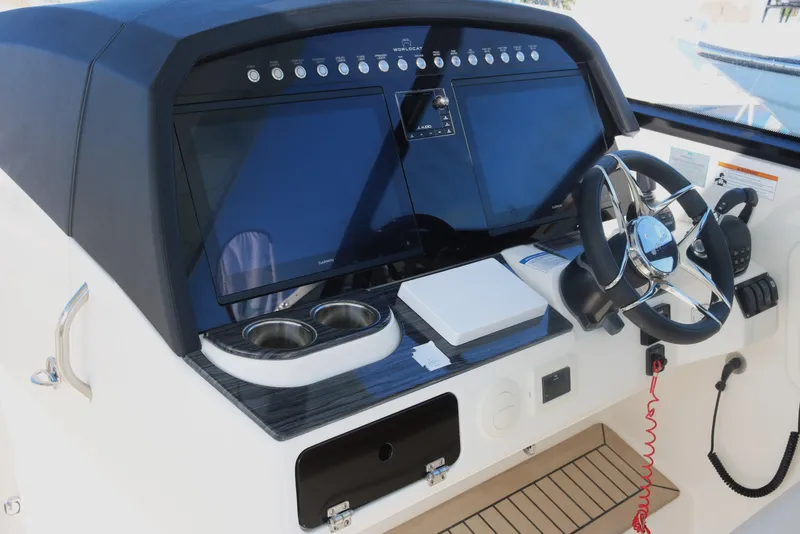 Slide: The Image of 2023 World Cat 400DC-X helm with dual screens and modern controls. - 5