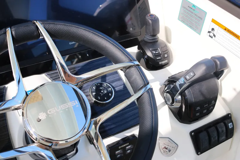 Slide: The Image of Steering wheel and controls of 2023 World Cat 400DC-X boat. - 6