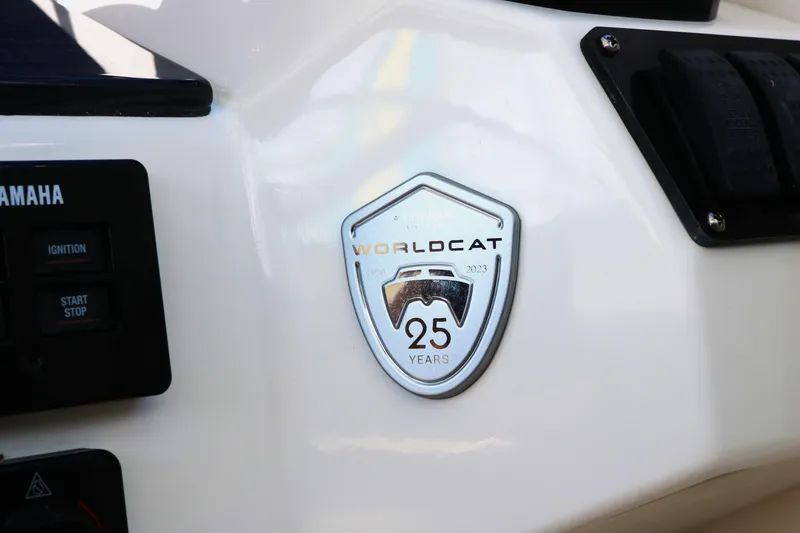 Slide: The Image of World Cat 400DC-X 2023 model badge celebrating 25 years. - 7