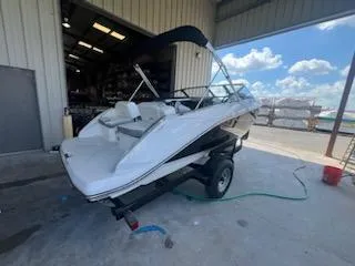 Slide: The Image of 2017 Scarab 195 boat on trailer in a warehouse. - 3