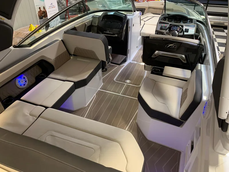 Slide: The Image of 2023 Monterey 298 Super Sport boat interior with luxurious seating and modern dashboard. - 12