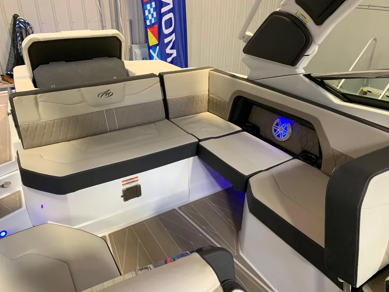 Slide: The Image of 2023 Monterey 298 Super Sport boat interior with luxurious seating and modern design. - 15