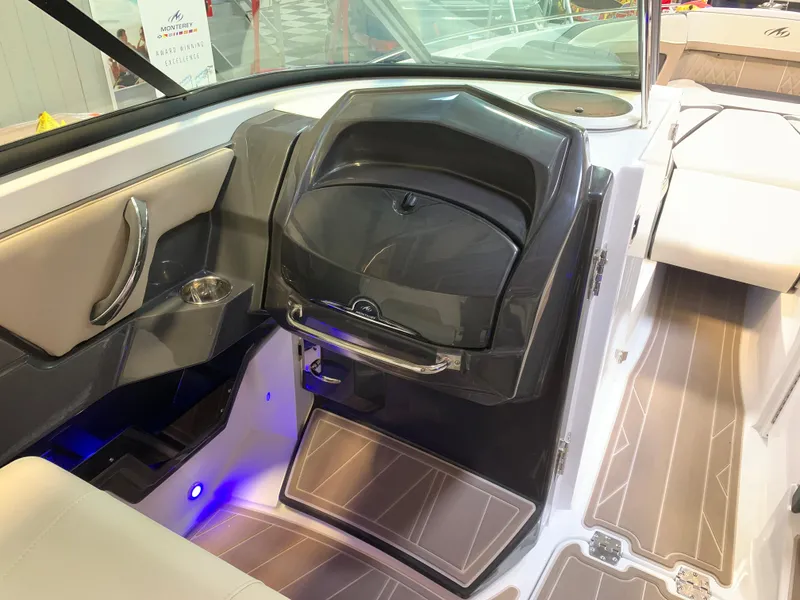 Slide: The Image of 2023 Monterey 298 Super Sport boat interior with modern dashboard and seating. - 16
