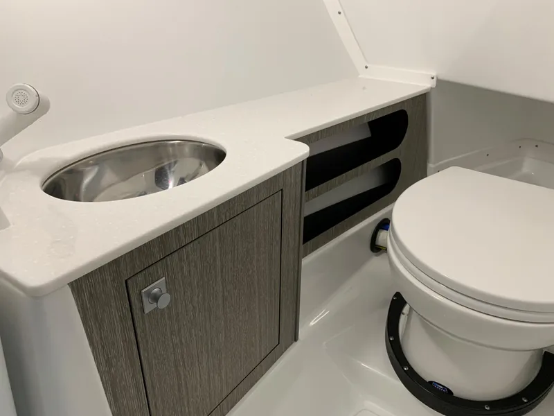 Slide: The Image of 2023 Monterey 298 Super Sport boat bathroom with sink and toilet. - 18