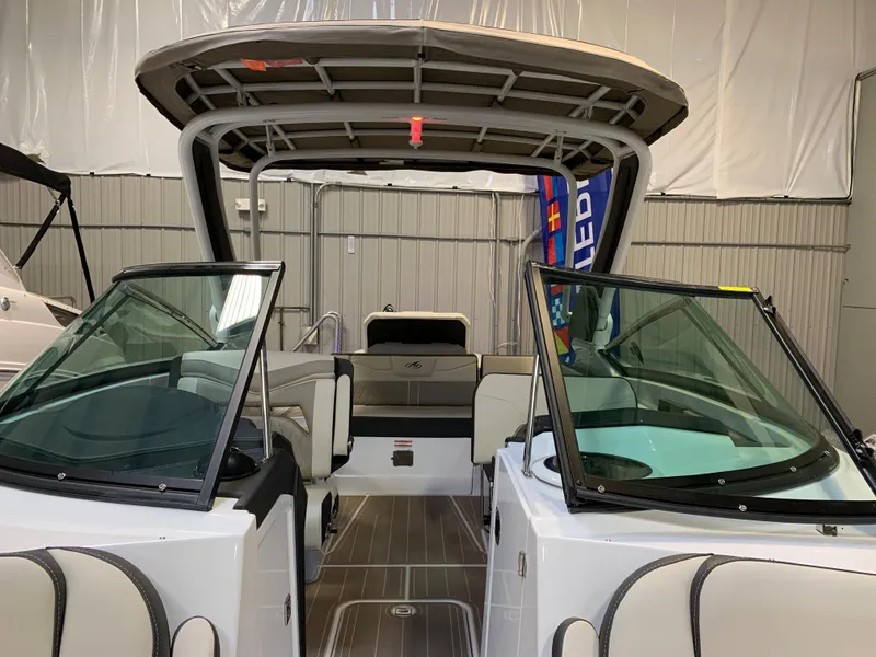 Slide: The Image of 2023 Monterey 298 Super Sport boat interior with open windshield and seating. - 21