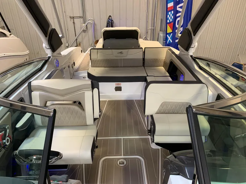 Slide: The Image of 2023 Monterey 298 Super Sport boat interior with luxurious seating and modern design. - 22