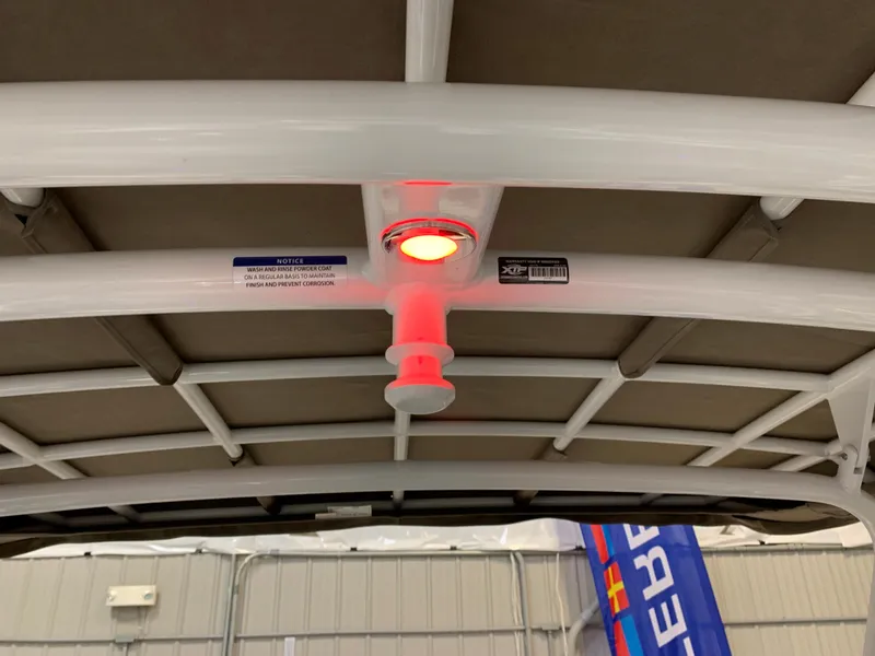 Slide: The Image of 2023 Monterey 298 Super Sport boat interior roof with red light. - 23