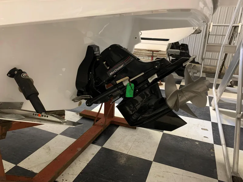 Slide: The Image of 2023 Monterey 298 Super Sport boat stern drive on checkered floor. - 3