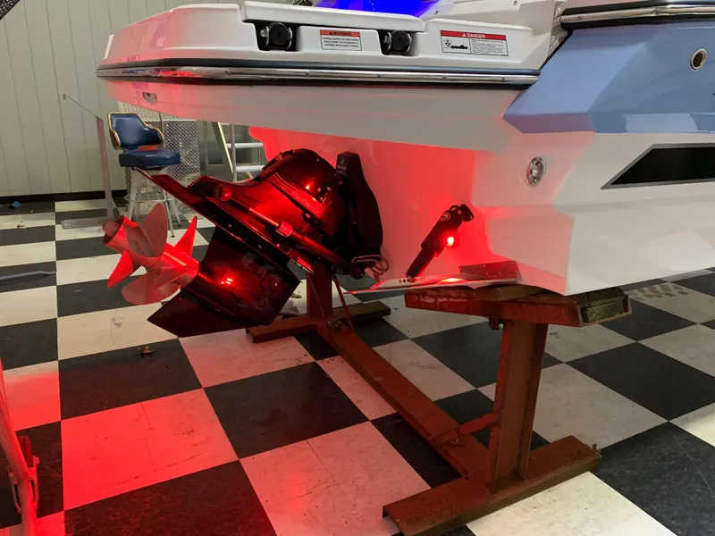 Slide: The Image of 2023 Monterey 298 Super Sport boat stern with red underwater lights. - 5