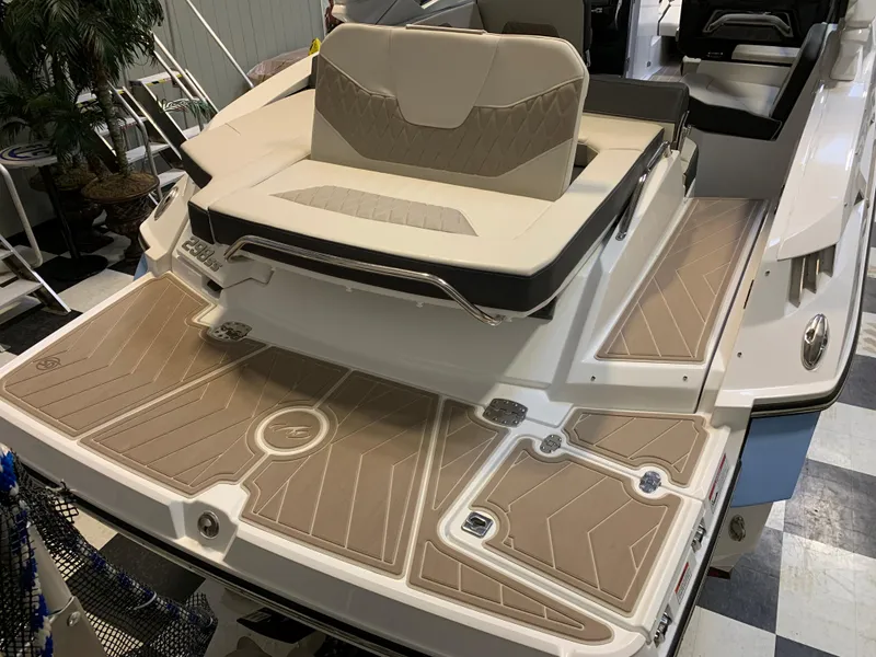 Slide: The Image of 2023 Monterey 298 Super Sport boat with beige seating and deck. - 6