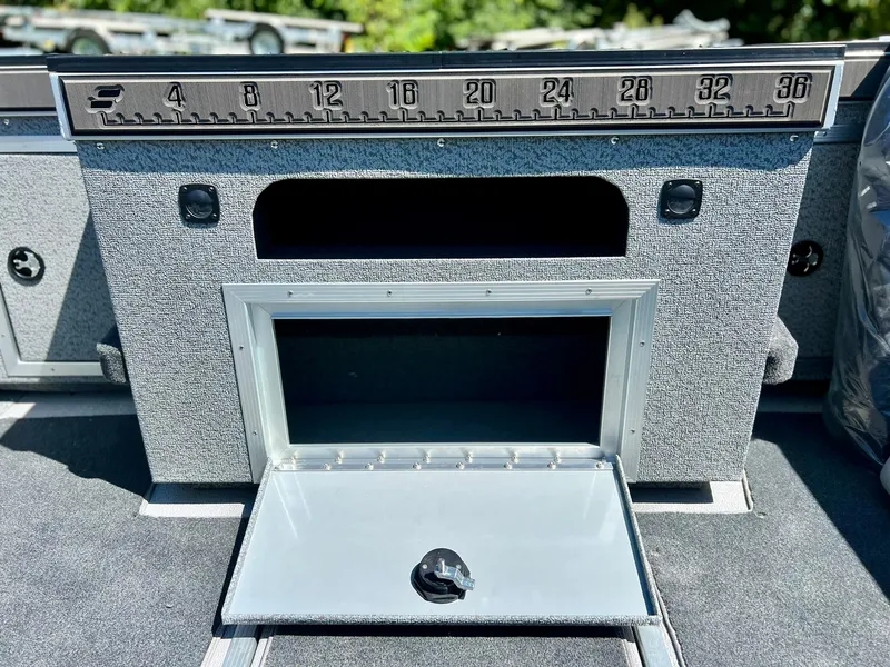 Slide: The Image of Starcraft Fishmaster 210 boat storage compartment with measuring ruler, 2023 model. - 16