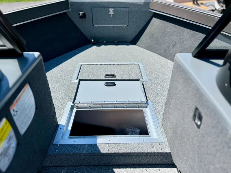 Slide: The Image of 2023 Starcraft Fishmaster 210 boat interior with storage compartments. - 8