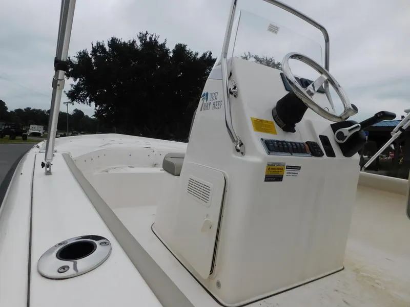 Slide: The Image of 2023 Key West 188 BR boat console with steering wheel and controls. - 10