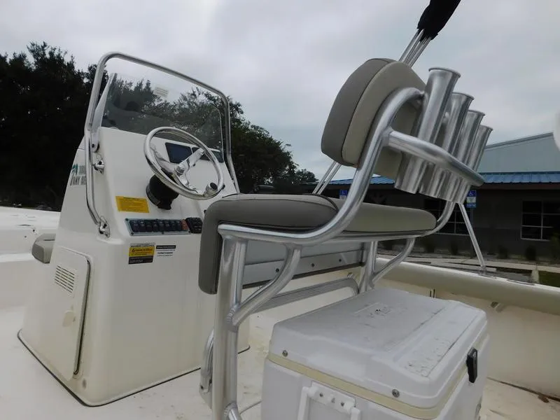 Slide: The Image of 2023 Key West 188 BR boat console and seating area. - 4