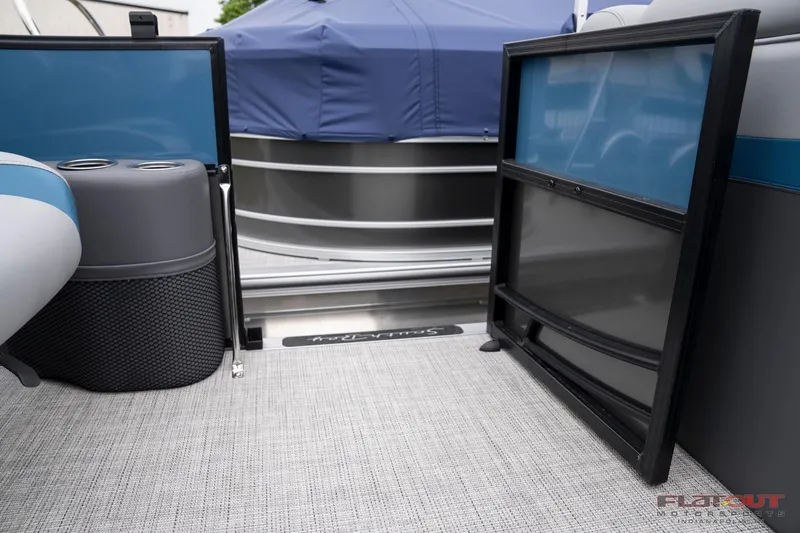 Slide: The Image of 2023 South Bay RearSeating 200hp pontoon boat interior with open gate and covered exterior. - 14
