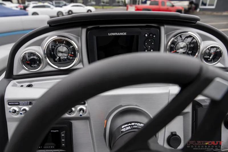 Slide: The Image of 2023 South Bay RearSeating 200hp boat dashboard with Lowrance display and gauges. - 15