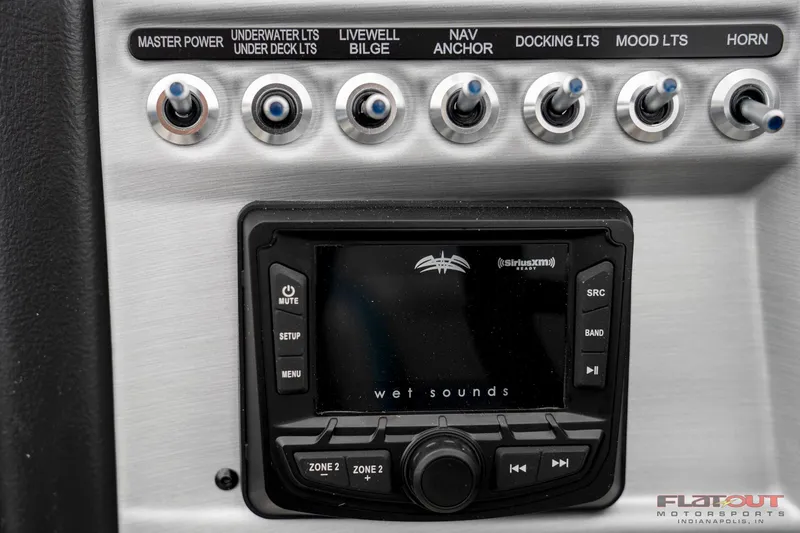 Slide: The Image of Control panel of a 2023 South Bay RearSeating 200hp boat with Wet Sounds audio system. - 18