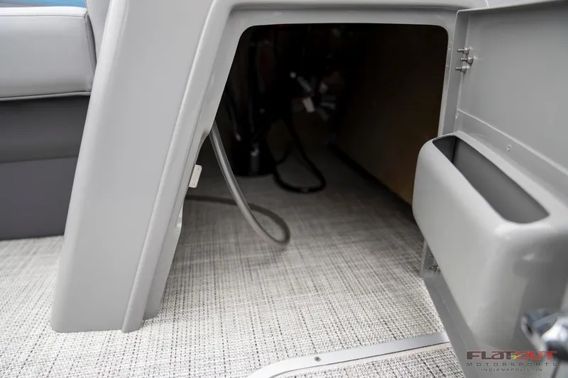 Slide: The Image of 2023 South Bay RearSeating 200hp boat interior storage compartment. - 27